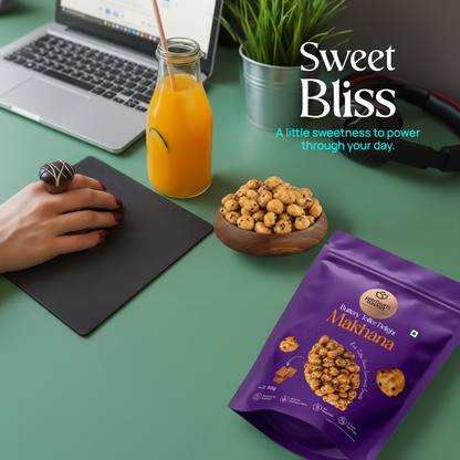 Makhana snack pouch on desk, purple bag with bowl of roasted makhana nearby